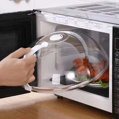 Hand opening the splash guard over a plate of food inside a microwave with digital display and lettuce garnish visible