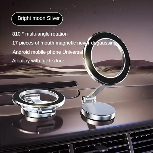 Silver magnetic ring phone mount shown folded and upright on a dashboard at dusk, labeled Bright Moon Silver