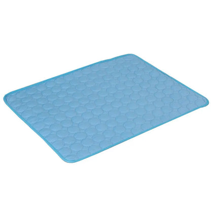 Sky-blue quilted cooling gel mat laid flat, angled studio shot on white background