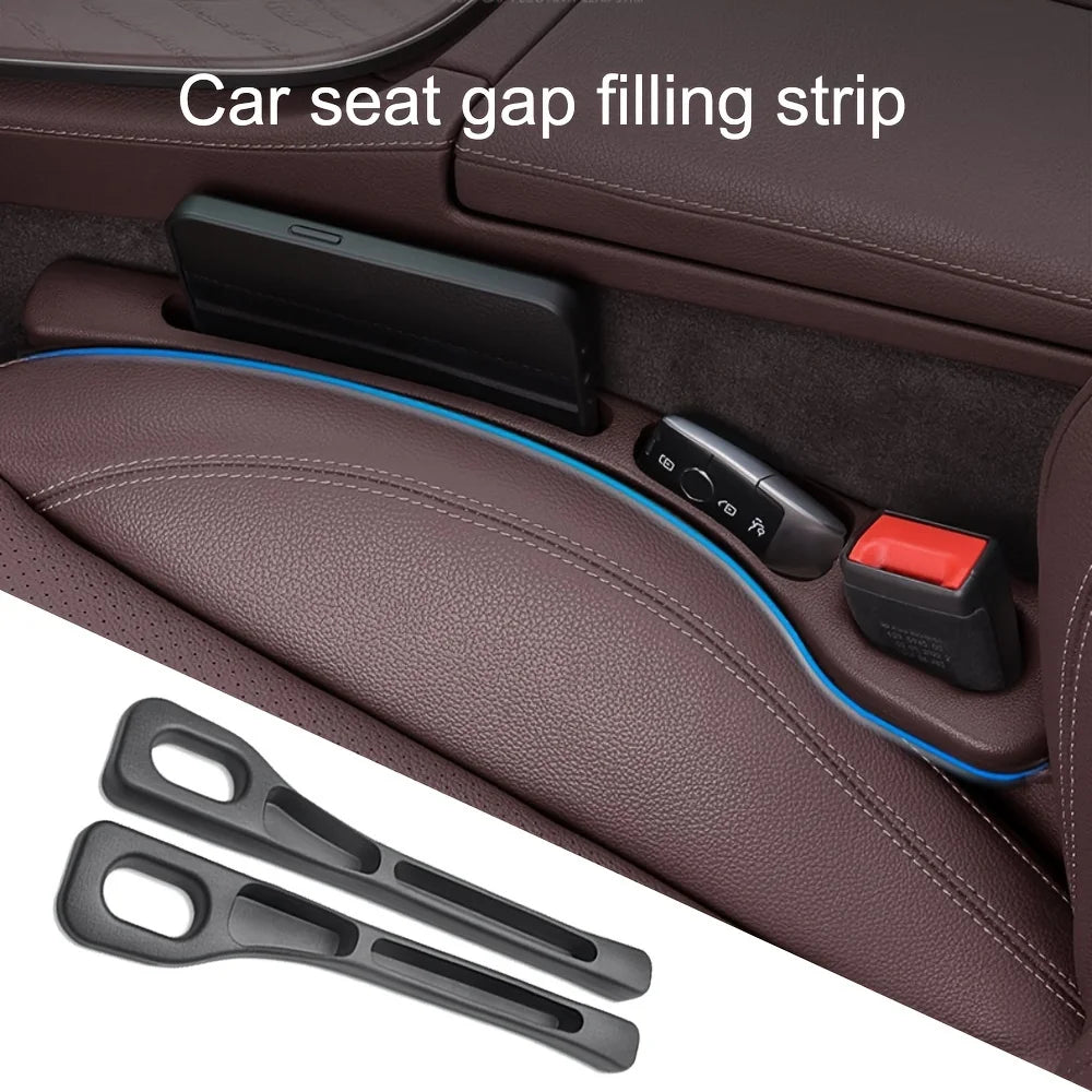Close-up of the blue-edged gap filler installed beside a phone and key fob in a brown leather seat