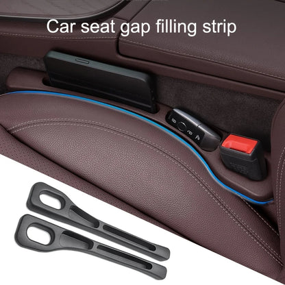 Close-up of the blue-edged gap filler installed beside a phone and key fob in a brown leather seat
