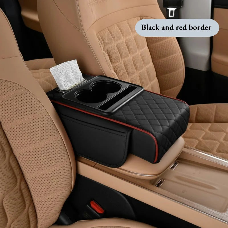 Black quilted armrest cushion with red trim, cup holder tray, and tissue box on tan car seats