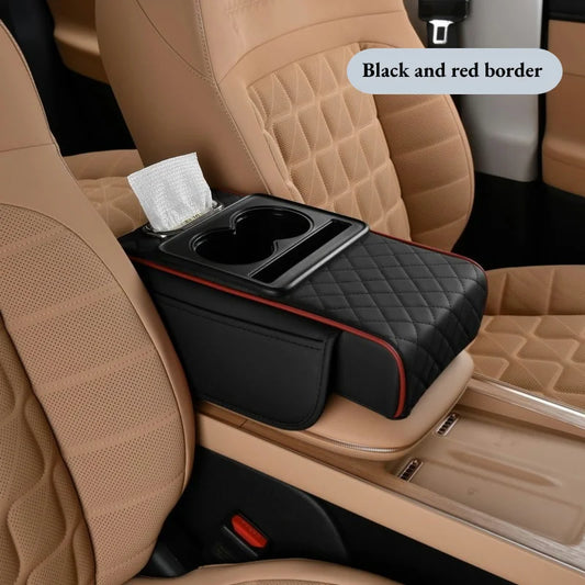Black quilted armrest cushion with red trim, cup holder tray, and tissue box on tan car seats