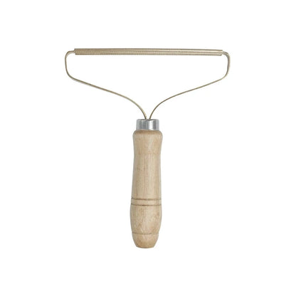 Wooden-handled wire-loop lint comb alone on white background, front view