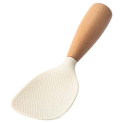 White silicone rice paddle with beech wood handle, angled studio shot on white background
