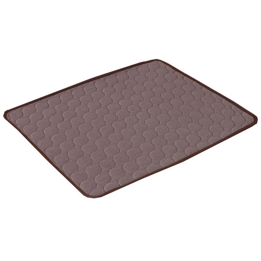 Brown quilted circle-pattern cooling gel mat laid flat, angled studio shot on white background