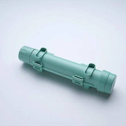 Mint green sushi-rolling tube device shown diagonally on a white background