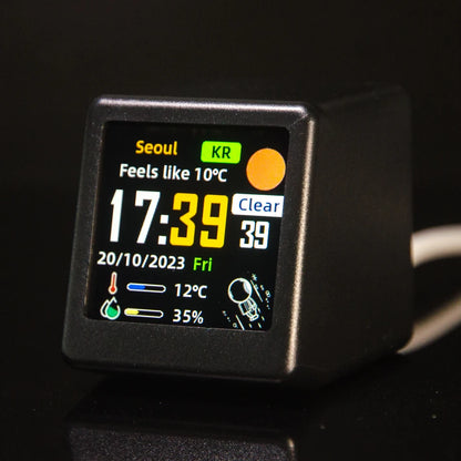 Black weather clock front view showing 'Feels like 10°C' Seoul weather display at 17:39
