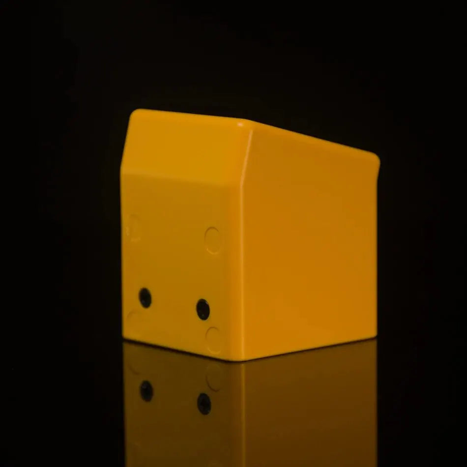 Rear view of yellow weather clock case showing screw mounting holes on black background
