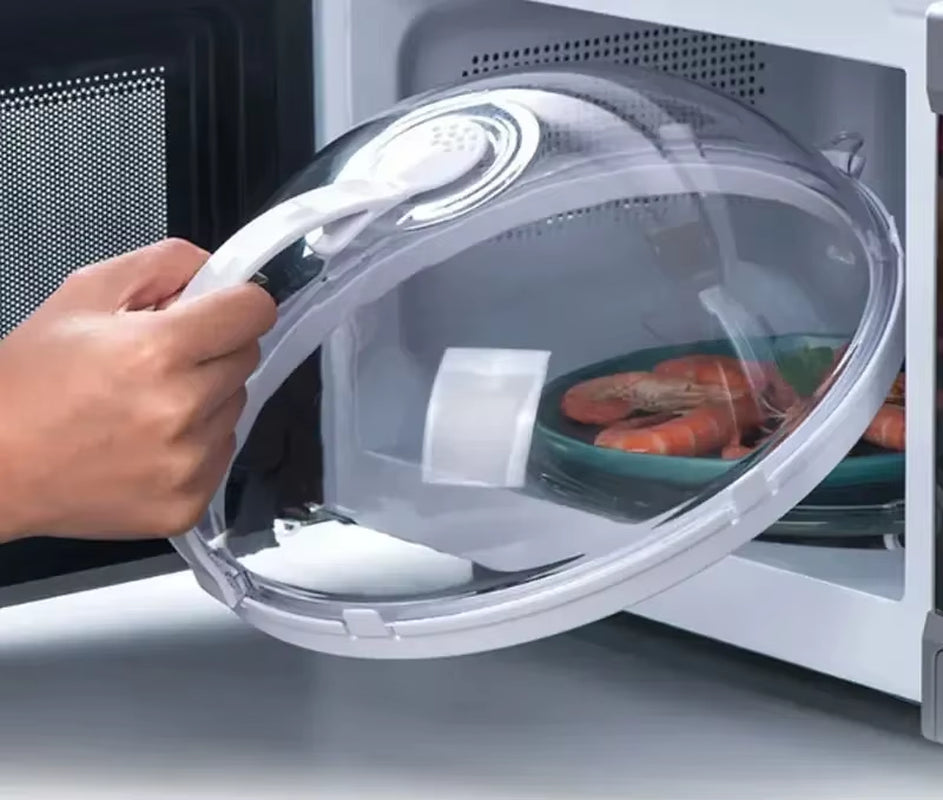Hand lifting the white-rimmed splash guard off a teal plate of shrimp inside a microwave