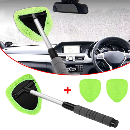 Telescopic window brush with green pad shown on a foggy windshield, inset over a car dashboard