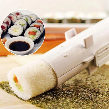 Close-up of the device pressing a finished rice roll onto a nori sheet, with inset of sliced sushi rolls in soy sauce