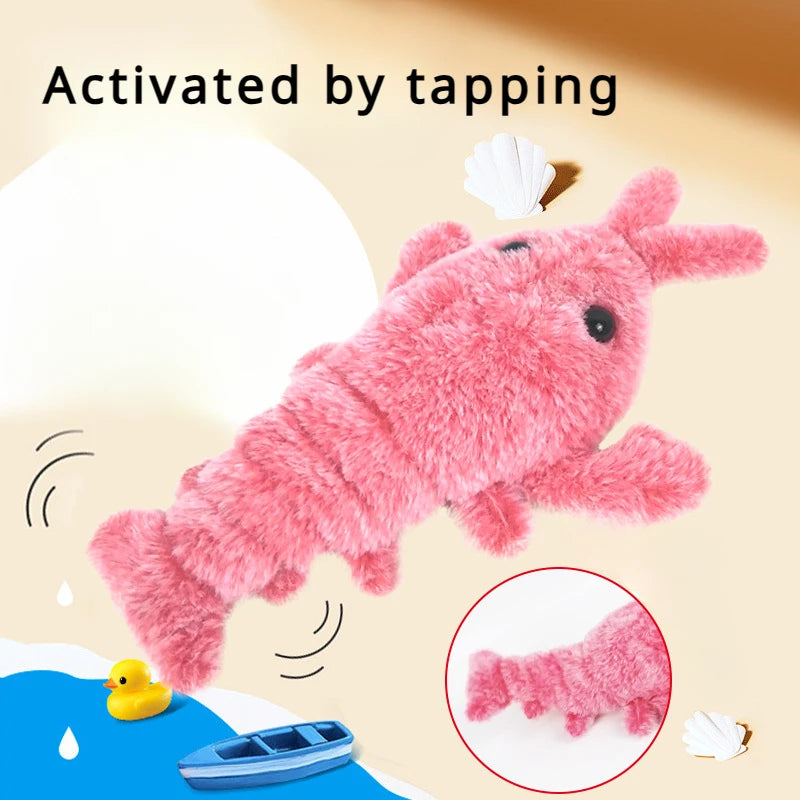 Activated by tapping graphic showing the pink plush shrimp toy on a beach-themed background with a rubber duck and toy boat