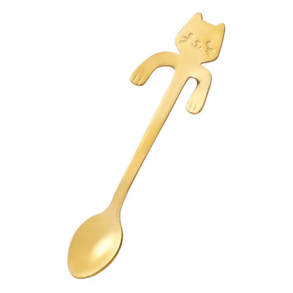 Gold stainless steel cat-shaped spoon shown diagonally on a white background