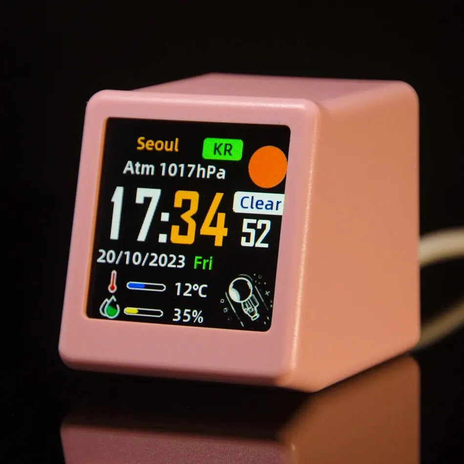 Pink weather clock front view displaying atmospheric pressure reading of 1017hPa for Seoul