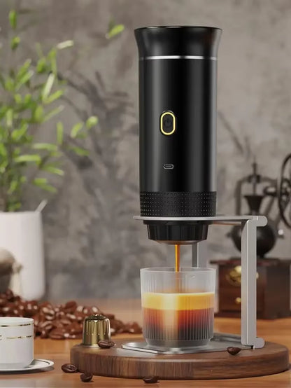 Black espresso machine brewing a layered shot into a glass cup on a wood stand, with coffee beans and a cafe backdrop