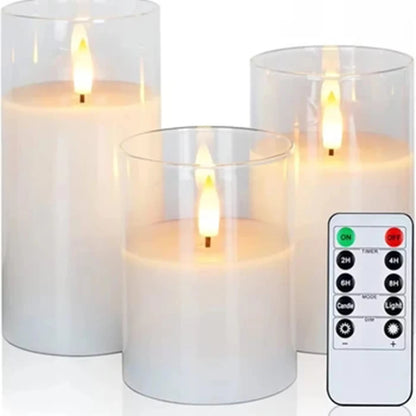 Three clear glass LED candles with warm flickering flames, close-up on white background