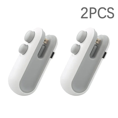 Two white and gray mini heat sealers side by side, labeled 2PCS