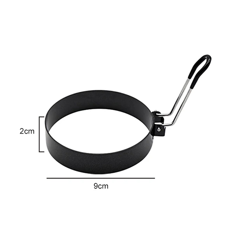 Black egg ring with black handle, dimension diagram showing 9cm diameter and 2cm height