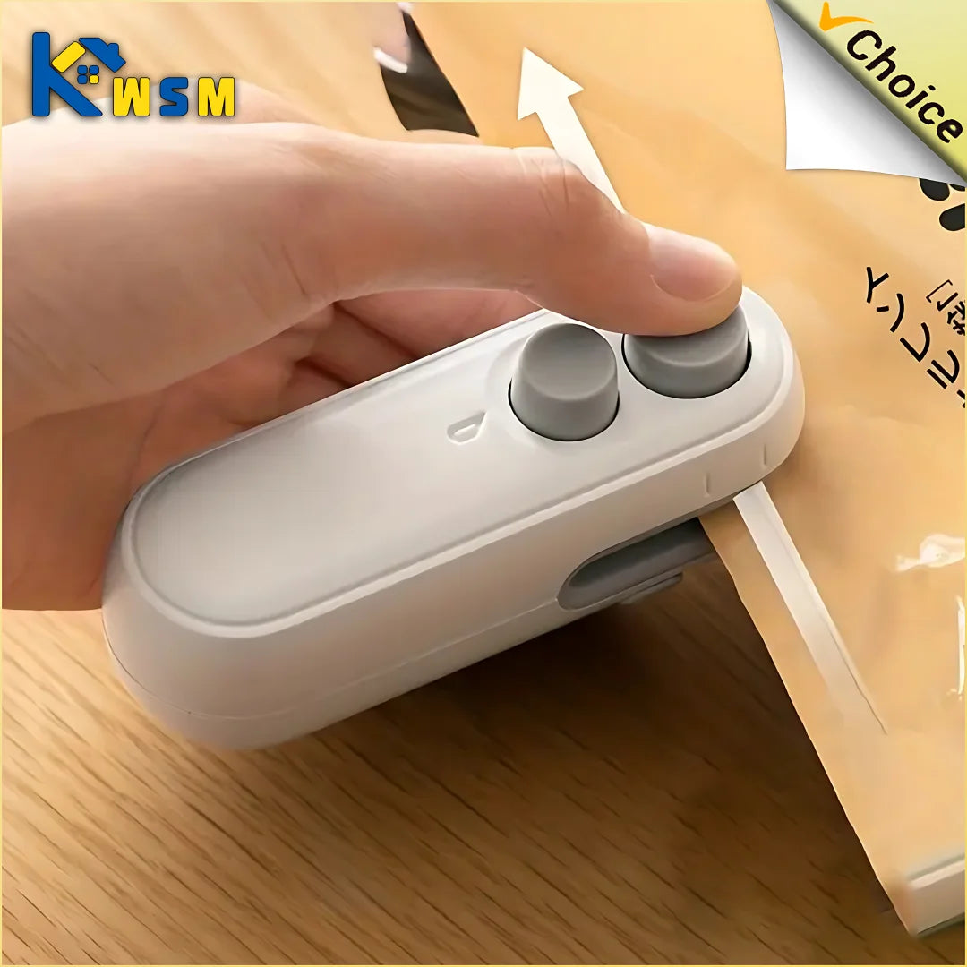Hand pressing the sealer's button to seal a snack bag on a wood table