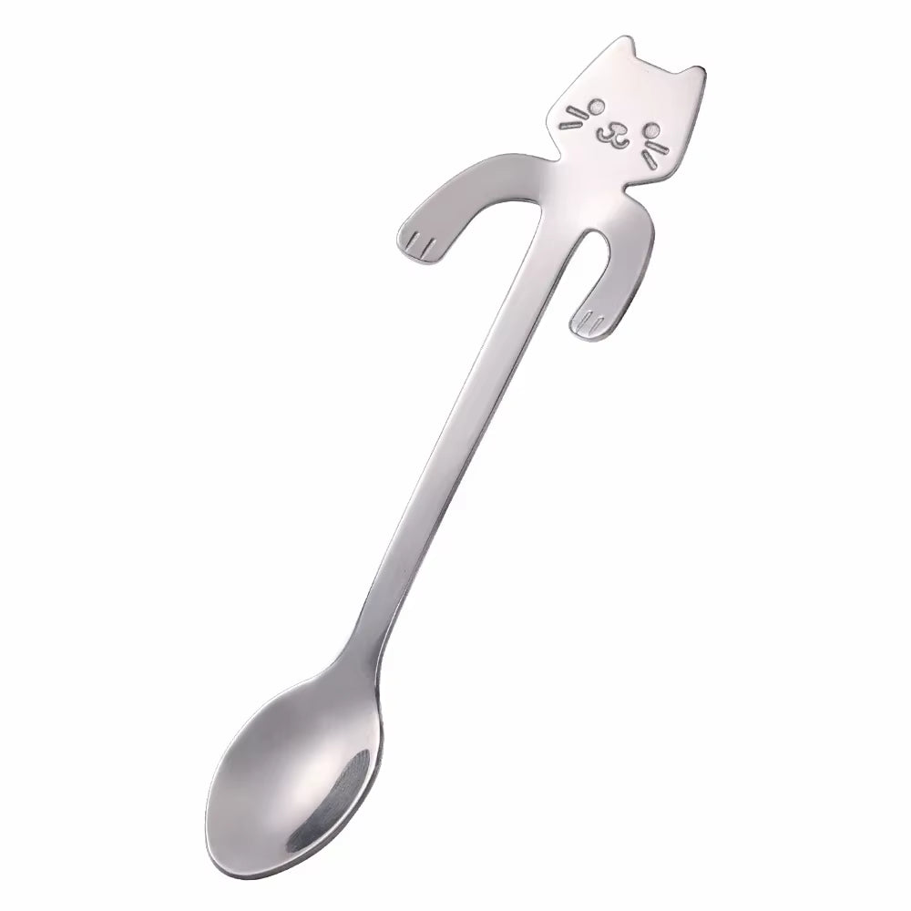 Silver cat-shaped spoon shown diagonally on a white background