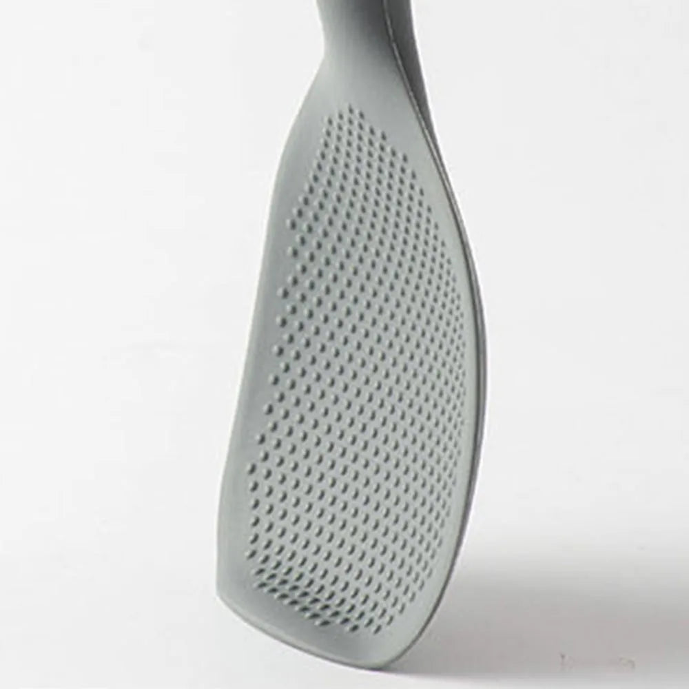 Close-up of the textured dotted underside of the gray silicone paddle head