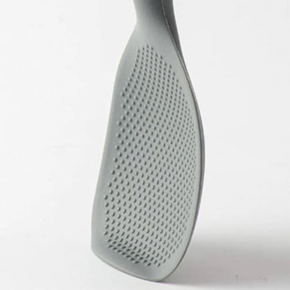 Close-up of the textured dotted underside of the gray silicone paddle head