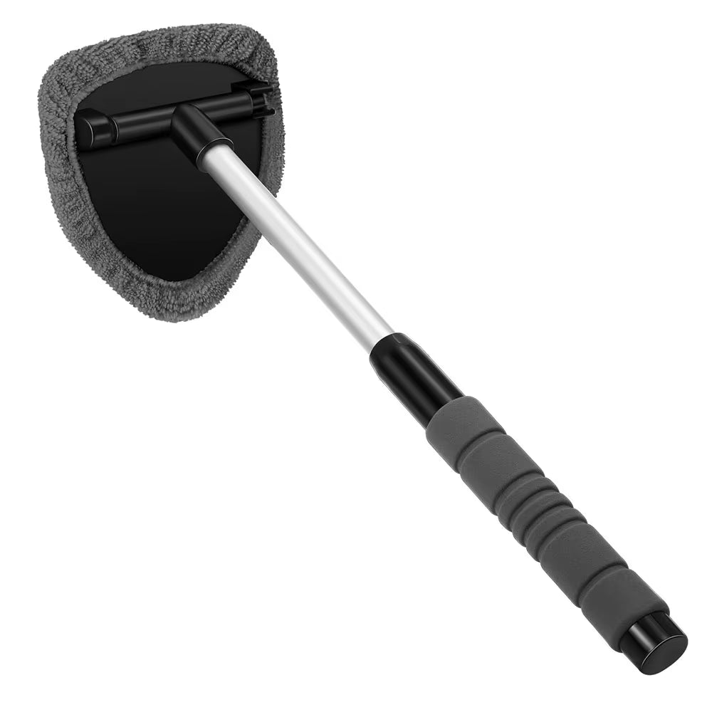 Product shot of the brush with grey microfiber head and extendable handle on white background