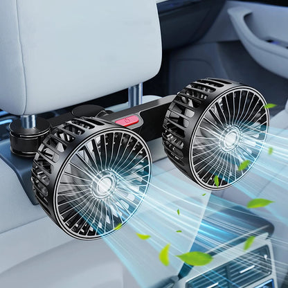 Fan clipped to a headrest with both heads angled forward, visible airflow streams and green leaf graphics