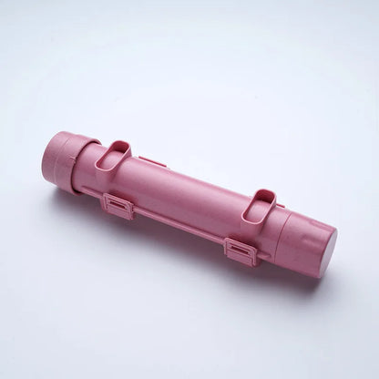 Pink sushi-rolling tube device shown diagonally on a white background