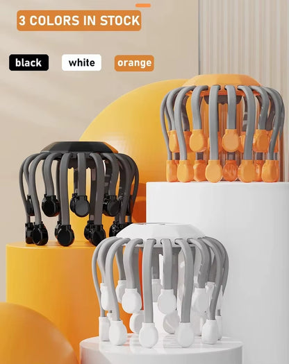 Scalp massager shown in black, white, and orange color options
